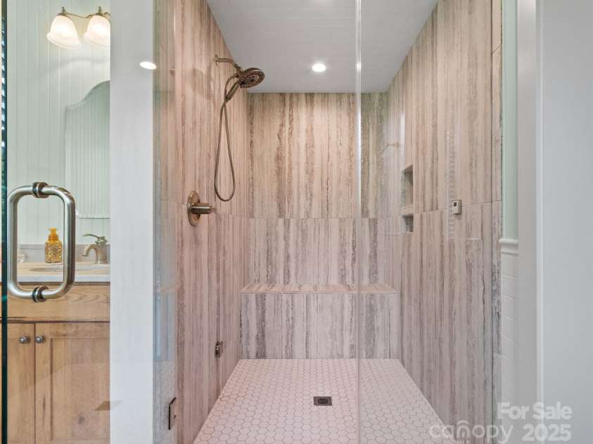 971 Banks Creek Road, Burnsville, NC 28714.  MLS# CAR4270100, YatesRealty ID 21780. Luxurious tiled steam shower for a spa-like experience.
