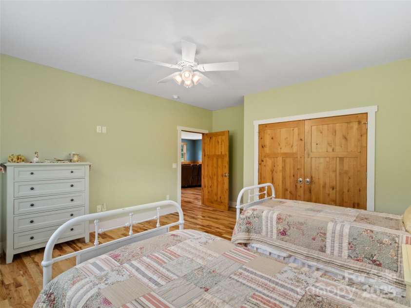 971 Banks Creek Road, Burnsville, NC 28714.  MLS# CAR4270100, YatesRealty ID 21780. Spacious upstairs bedroom featuring ample closet space for added convenience