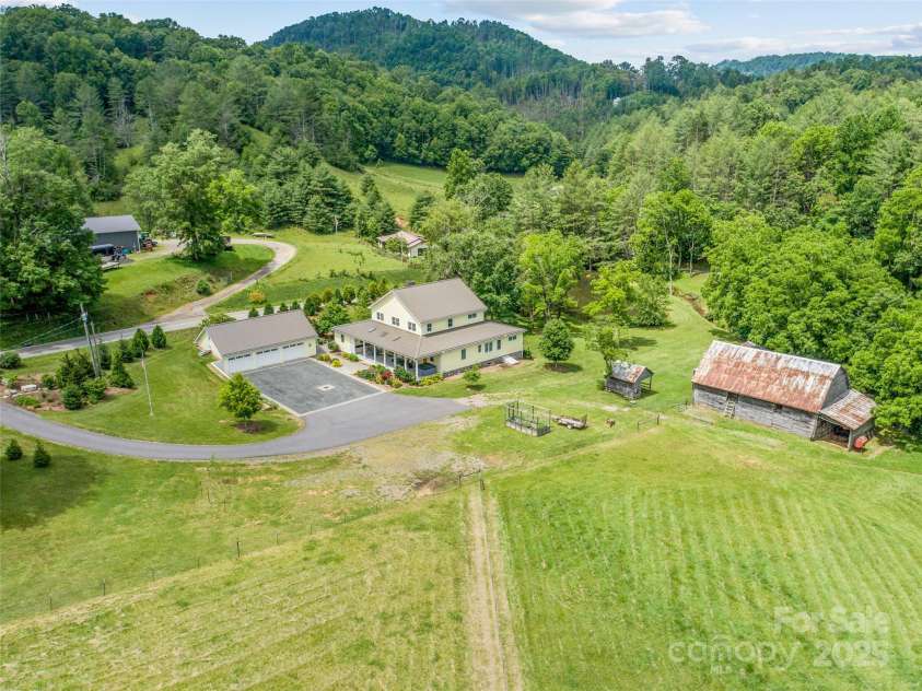 971 Banks Creek Road, Burnsville, NC 28714.  MLS# CAR4270100, YatesRealty ID 21780. Spanning 12 usable acres, this mostly fenced and flat pasture is enhanced by a creek that runs alongside