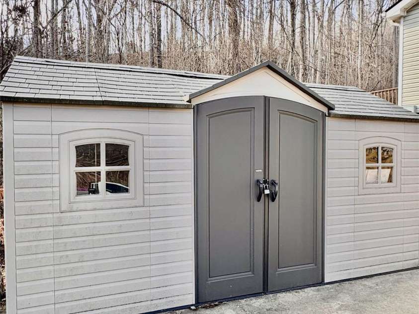 231 Newberry Drive, Fletcher, NC 28732.  MLS# CAR4221734, YatesRealty ID 21787. Storage Building Stays