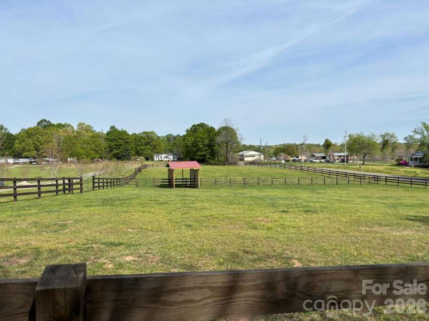 378 Collinsville Road, Columbus, NC 28722.  MLS# CAR4366416, YatesRealty ID 21793. 2 fenced pastures with a run-in paddock on the other side of the driveway from the guest quarters/barn. Ready for your horses or other fur babies!
