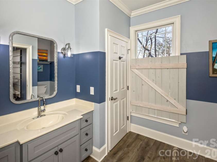 378 Collinsville Road, Columbus, NC 28722.  MLS# CAR4366416, YatesRealty ID 21793. En suite bath for the first guest bedroom.