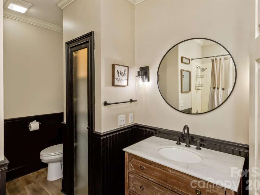 378 Collinsville Road, Columbus, NC 28722.  MLS# CAR4366416, YatesRealty ID 21793. The 3rd full bathroom on the main level serves as a guest bath and easily accessible from bedroom 3 and the office/flex space.