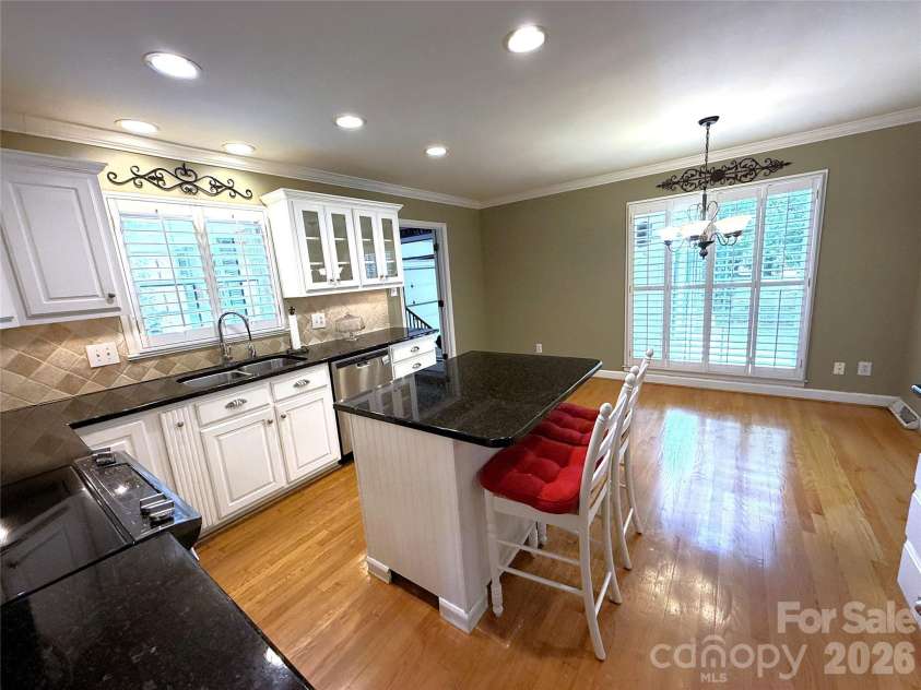 2530 Weathersford Road, Mint Hill, NC 28227.  MLS# CAR4376726, YatesRealty ID 21798. Light-filled kitchen and breakfast area with expansive windows and open layout.