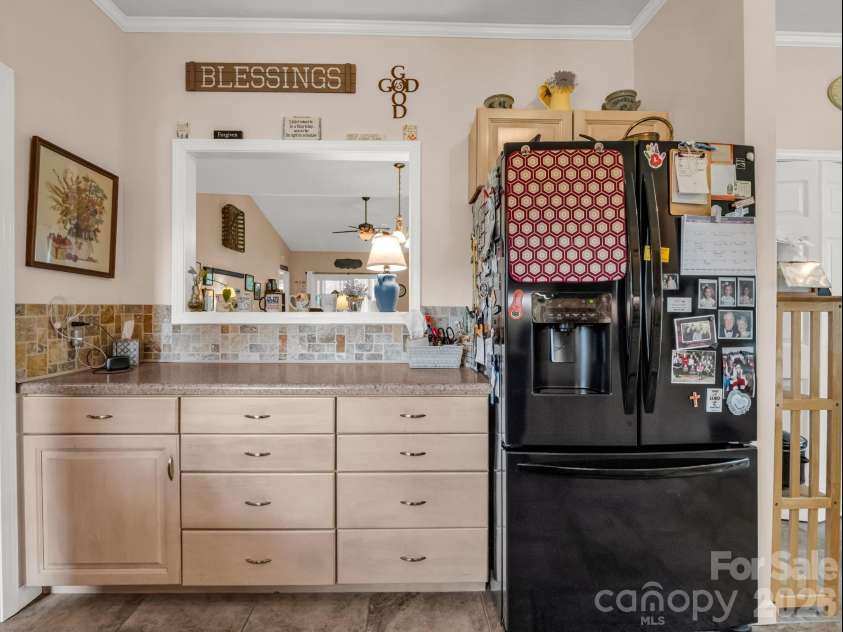 20 Country Meadows Lane, Hendersonville, NC 28792.  MLS# CAR4338193, YatesRealty ID 21809. A framed window into dining area