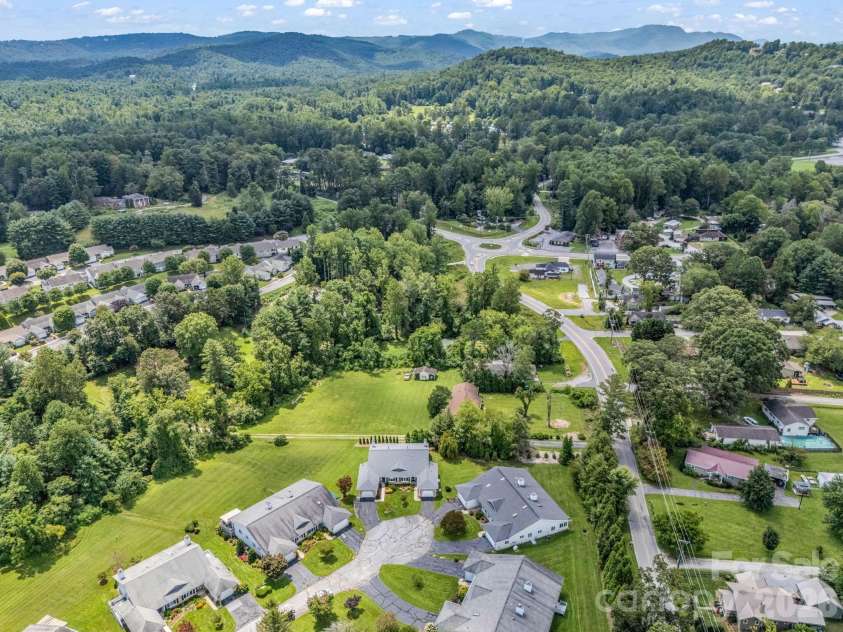 20 Country Meadows Lane, Hendersonville, NC 28792.  MLS# CAR4338193, YatesRealty ID 21809. Trees in back for good buffer