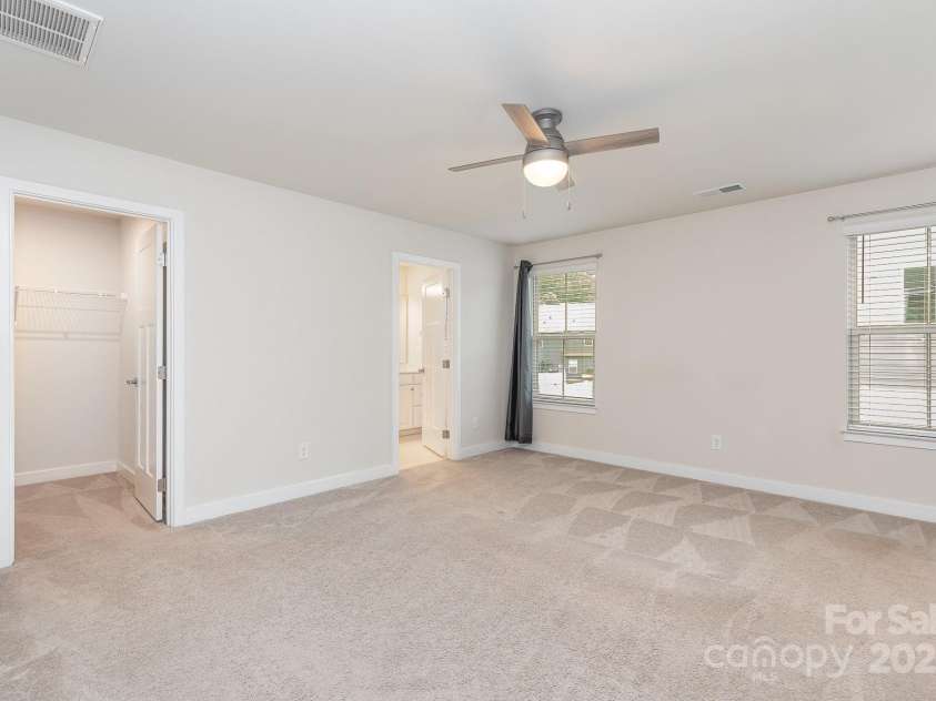 138 Lanyard Drive, Mooresville, NC 28117.  MLS# CAR4260575, YatesRealty ID 21810. Bright and inviting primary with walk in closet and ensuite bathroom