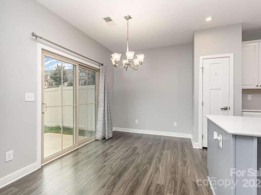 138 Lanyard Drive, Mooresville, NC 28117.  MLS# CAR4260575, YatesRealty ID 21810. Dining area opens to back yard