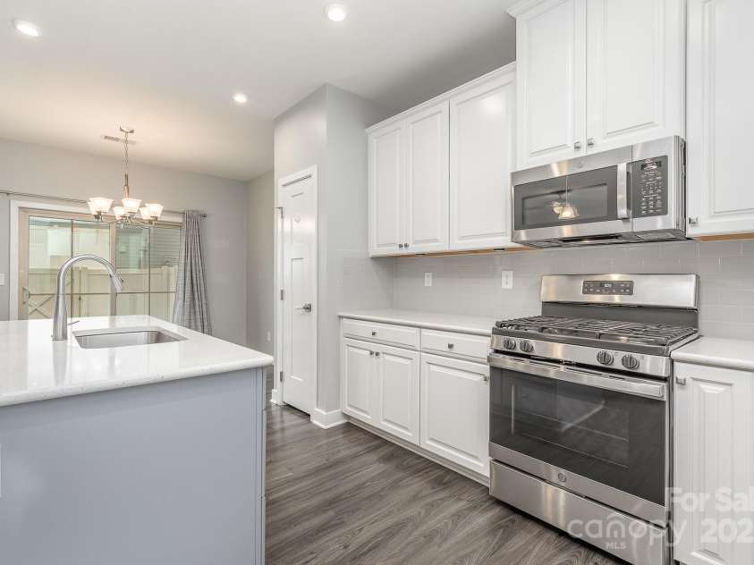 138 Lanyard Drive, Mooresville, NC 28117.  MLS# CAR4260575, YatesRealty ID 21810. Kitchen with ample cabinet space, pantry and eat at island