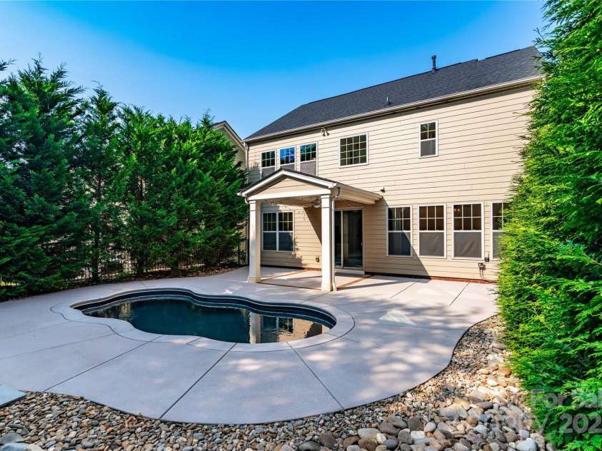 203 Rustling Waters Drive, Mooresville, NC 28117.  MLS# CAR4266533, YatesRealty ID 21811. Backyard oasis with POOL