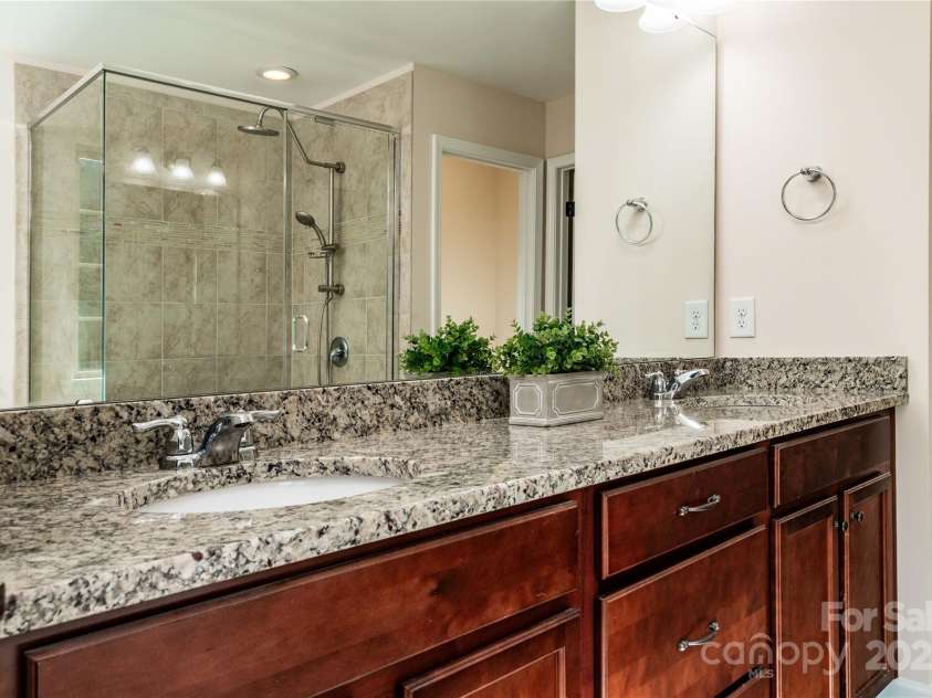 203 Rustling Waters Drive, Mooresville, NC 28117.  MLS# CAR4266533, YatesRealty ID 21811. Dual sinks and granite counter tops