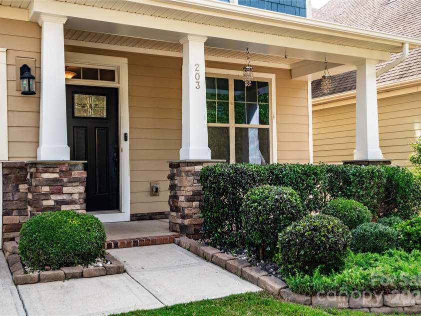 203 Rustling Waters Drive, Mooresville, NC 28117.  MLS# CAR4266533, YatesRealty ID 21811. Idyllic front porch