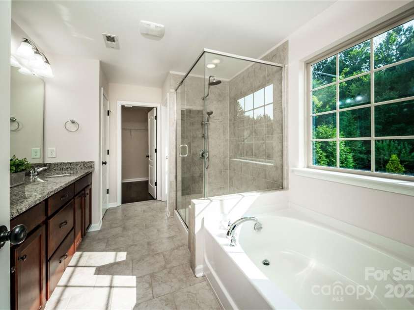 203 Rustling Waters Drive, Mooresville, NC 28117.  MLS# CAR4266533, YatesRealty ID 21811. Primary bathroom