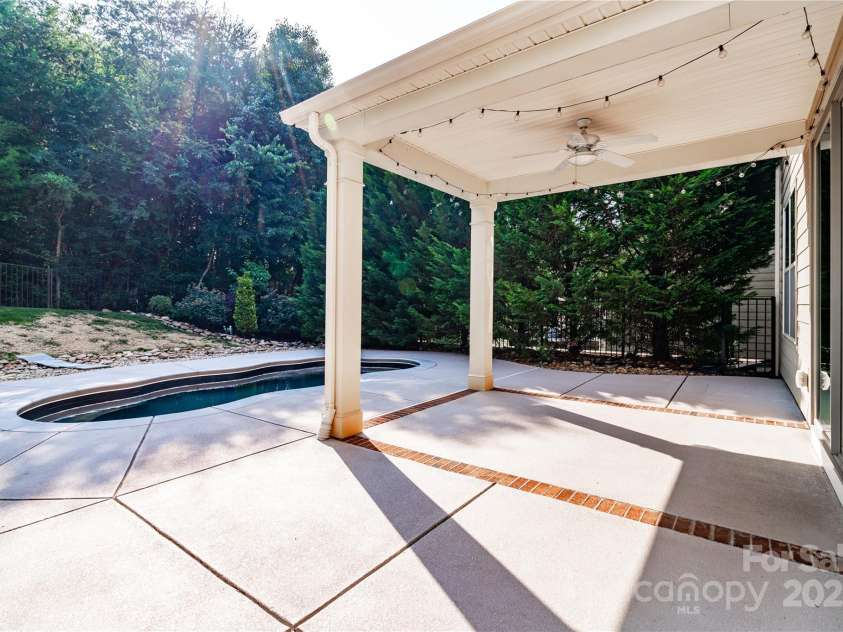 203 Rustling Waters Drive, Mooresville, NC 28117.  MLS# CAR4266533, YatesRealty ID 21811. Relax under the covered porch