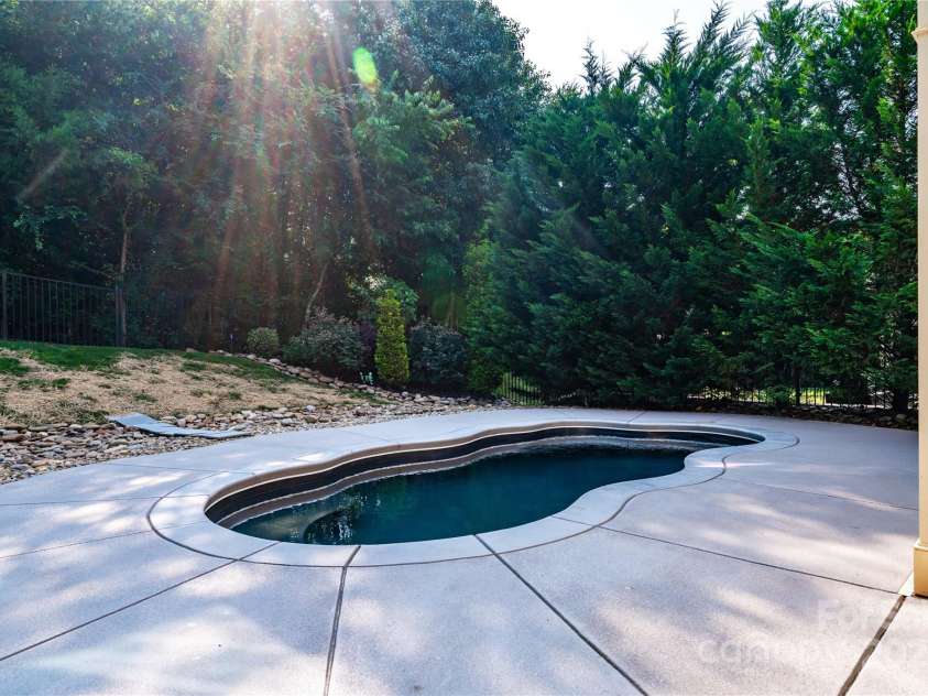 203 Rustling Waters Drive, Mooresville, NC 28117.  MLS# CAR4266533, YatesRealty ID 21811. Salt water pool