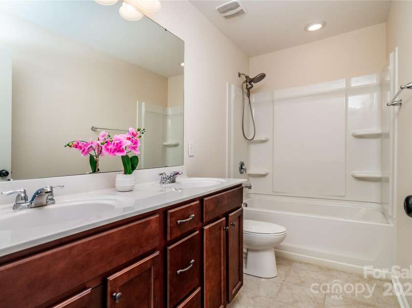 203 Rustling Waters Drive, Mooresville, NC 28117.  MLS# CAR4266533, YatesRealty ID 21811. Secondary bath with dual sinks