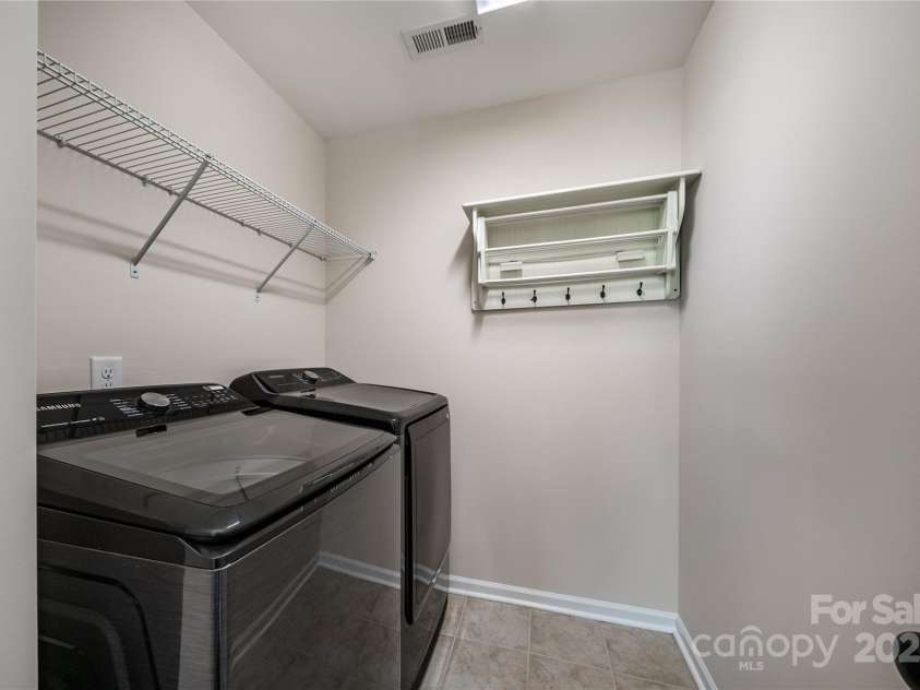 203 Rustling Waters Drive, Mooresville, NC 28117.  MLS# CAR4266533, YatesRealty ID 21811. Upstairs laundry room, washer and dryer convey!