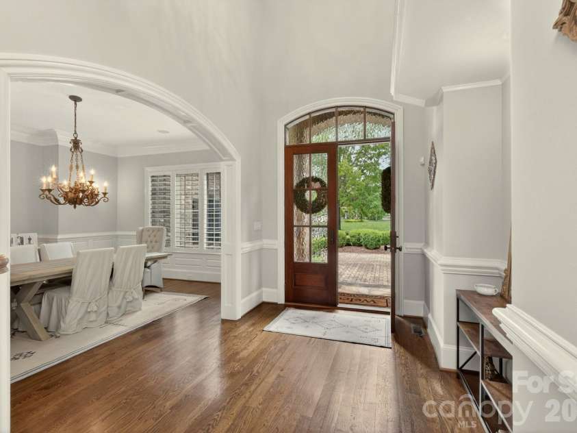 8304 Marcliffe Court, Waxhaw, NC 28173.  MLS# CAR4378365, YatesRealty ID 21811. Light filled foyer w/custom double glass doors.