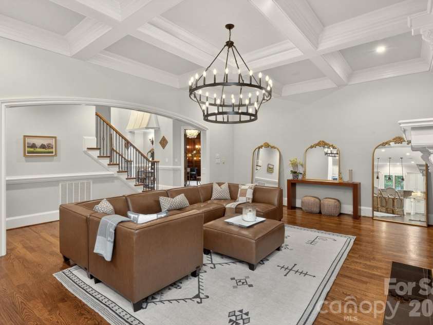 8304 Marcliffe Court, Waxhaw, NC 28173.  MLS# CAR4378365, YatesRealty ID 21811. Living room w/new chandelier