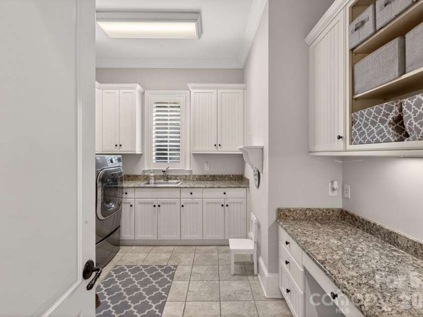 8304 Marcliffe Court, Waxhaw, NC 28173.  MLS# CAR4378365, YatesRealty ID 21811. Main Floor laundry room