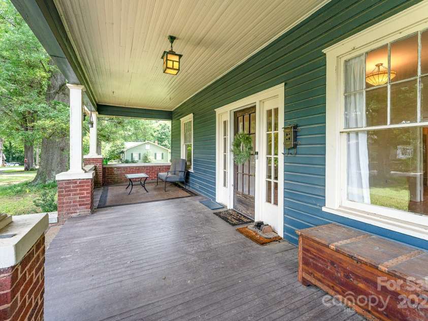 6206 Hunter Avenue, Charlotte, NC 28262.  MLS# CAR4272883, YatesRealty ID 21823. Now THAT'S a porch.  Sit and stay a while!