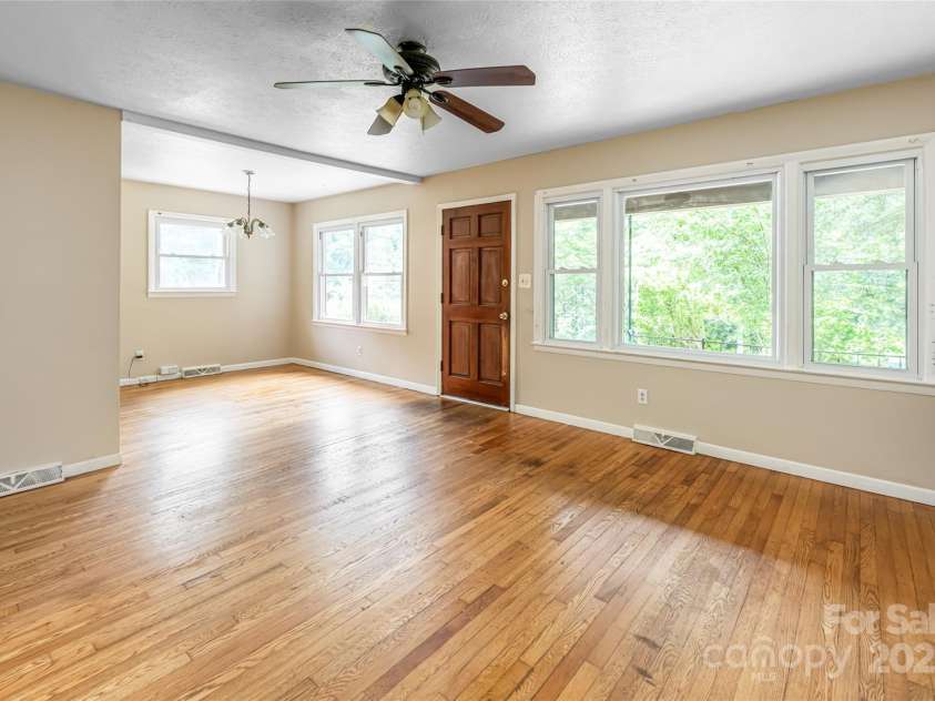 108 Morningside Drive, Asheville, NC 28806.  MLS# CAR4245785, YatesRealty ID 21826. Living room looking towards dining area