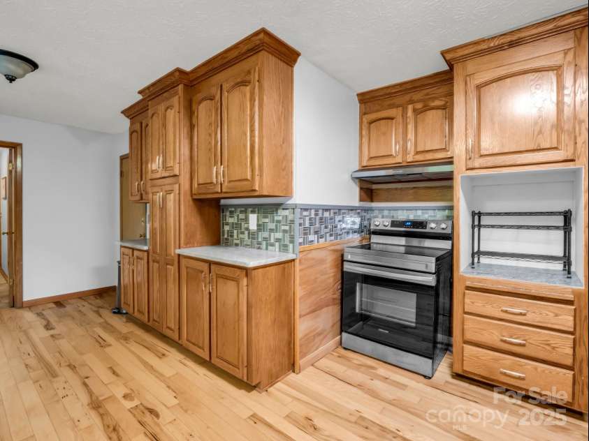 989 Mine Gap Road, Zirconia, NC 28790.  MLS# CAR4264634, YatesRealty ID 21834. Kitchen, door entrance from garage