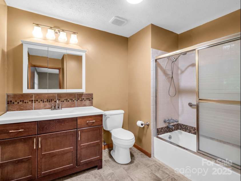 989 Mine Gap Road, Zirconia, NC 28790.  MLS# CAR4264634, YatesRealty ID 21834. Primary bathroom