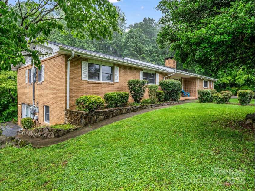 989 Mine Gap Road, Zirconia, NC 28790.  MLS# CAR4264634, YatesRealty ID 21834. Side of house and basement apt 1