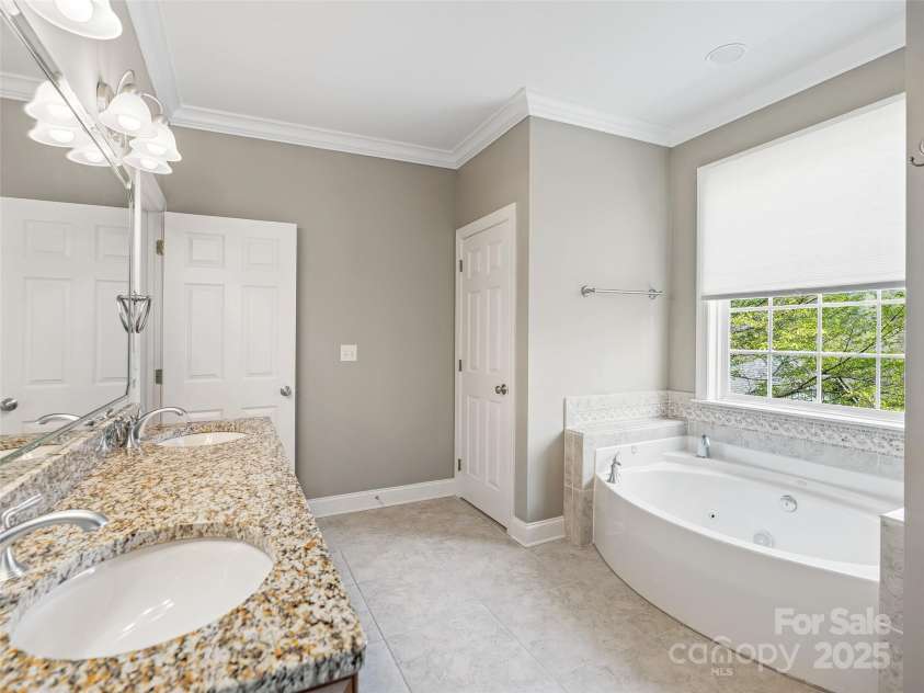 69 Ledgestone Drive, Fairview, NC 28730.  MLS# CAR4246045, YatesRealty ID 21842. Ensuite bathroom in 2nd Primary on lower level