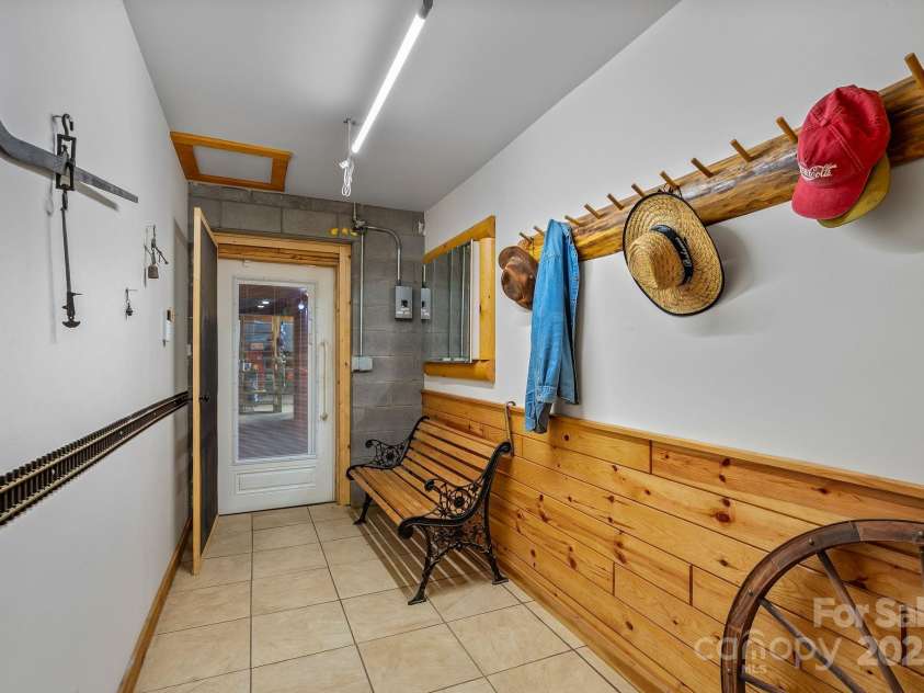 1104 Long Branch Road, Mars Hill, NC 28754.  MLS# CAR4252912, YatesRealty ID 21844. Lower Level Mud Room Between Game Room & Tunnel