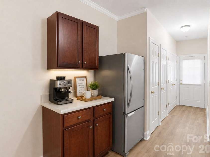 19762 Feriba Place, Cornelius, NC 28031.  MLS# CAR4378752, YatesRealty ID 21850. Additional cabinets - perfect coffee station - virtually staged.