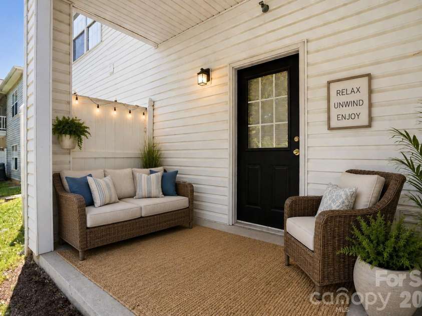 19762 Feriba Place, Cornelius, NC 28031.  MLS# CAR4378752, YatesRealty ID 21850. Back patio - virtually staged.