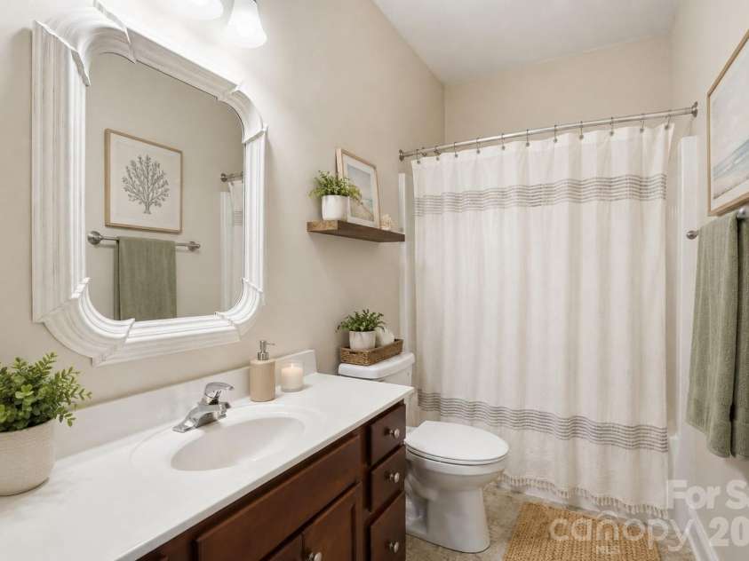 19762 Feriba Place, Cornelius, NC 28031.  MLS# CAR4378752, YatesRealty ID 21850. Guest bathroom with shower/tub combo - virtually staged.