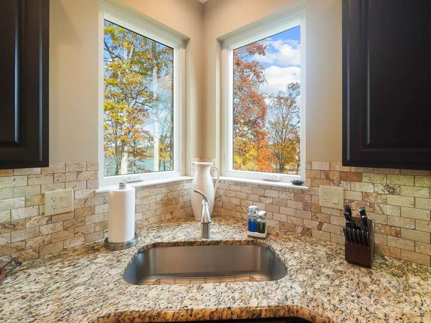 226 Hermance Lane, Mooresville, NC 28117.  MLS# CAR4234805, YatesRealty ID 21851. View the lake while you tidy up the Kitchen