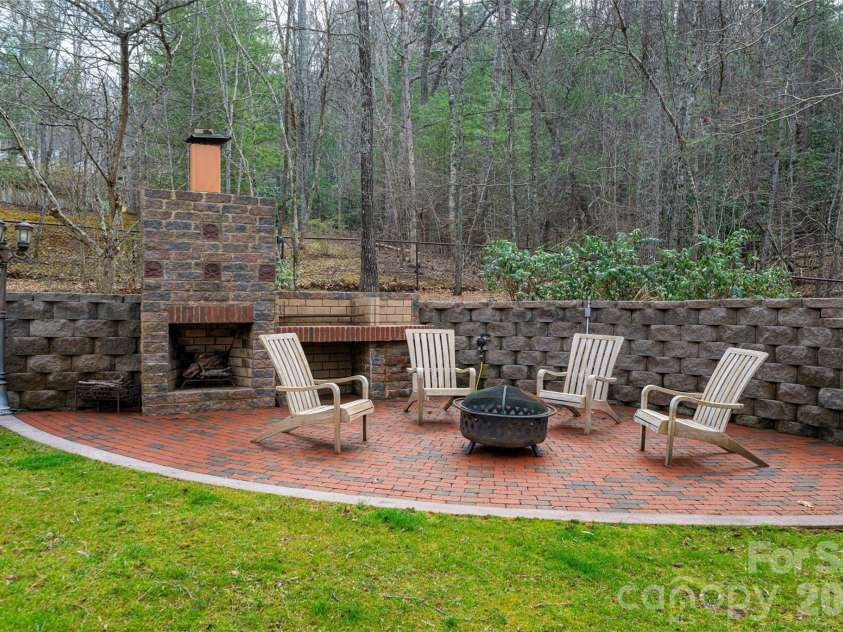 39 Windover Drive, Asheville, NC 28803.  MLS# CAR4352682, YatesRealty ID 21851. Back patio and fireplace