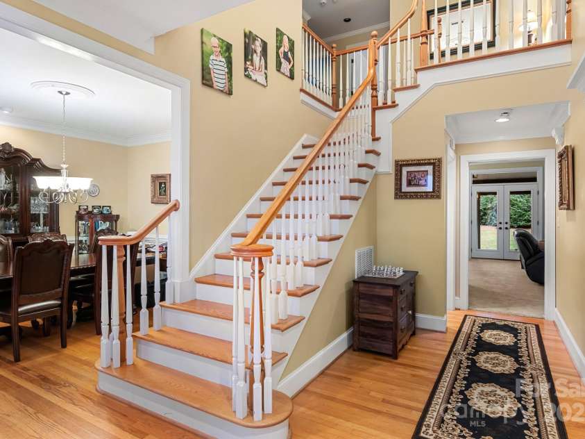 3419 Wylie Meadow Lane, Charlotte, NC 28269.  MLS# CAR4223040, YatesRealty ID 2186. Dual staircase on front of the house