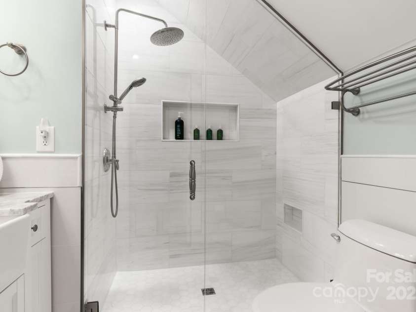 3419 Wylie Meadow Lane, Charlotte, NC 28269.  MLS# CAR4223040, YatesRealty ID 2186. Ensuite bath with solid marble zero entry shower