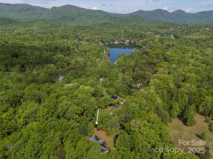 167 Lanier Drive, Landrum, SC 29356.  MLS# CAR4250453, YatesRealty ID 21861. This shows the proximity of the lake and mountains from an elevated view above the property.