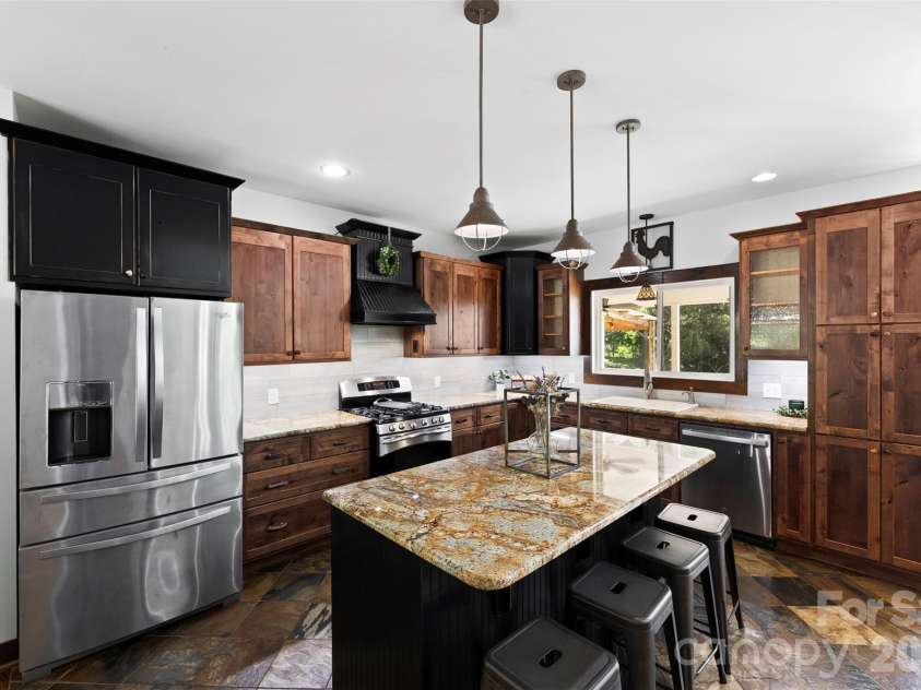 1205 French Belk Road, Mt Ulla, NC 28125.  MLS# CAR4377325, YatesRealty ID 21866. Custom kitchen with large island