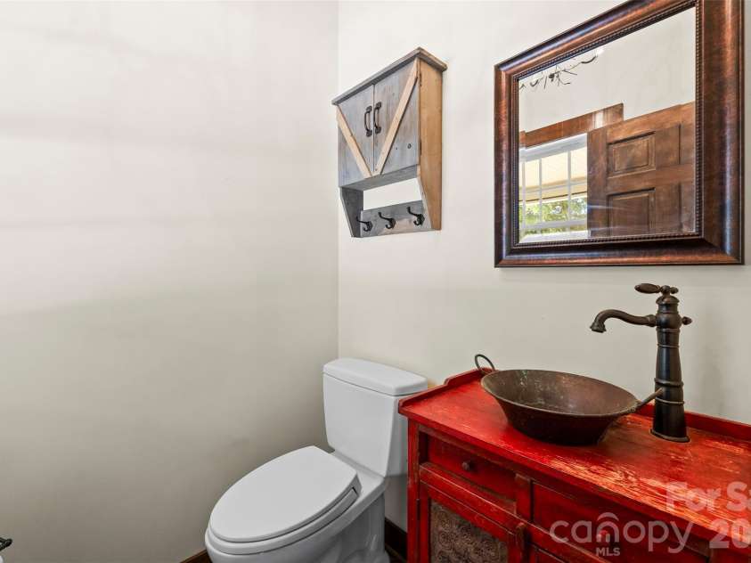 1205 French Belk Road, Mt Ulla, NC 28125.  MLS# CAR4377325, YatesRealty ID 21866. Main level half bath