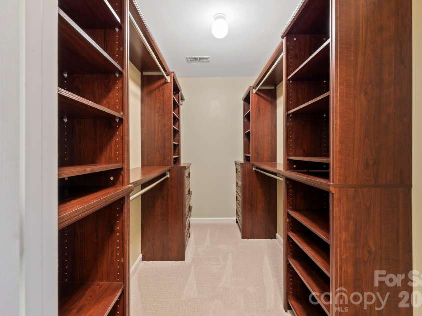 241 Fairway View Drive, Etowah, NC 28729.  MLS# CAR4304614, YatesRealty ID 2187. Primary Closet with wood organization system