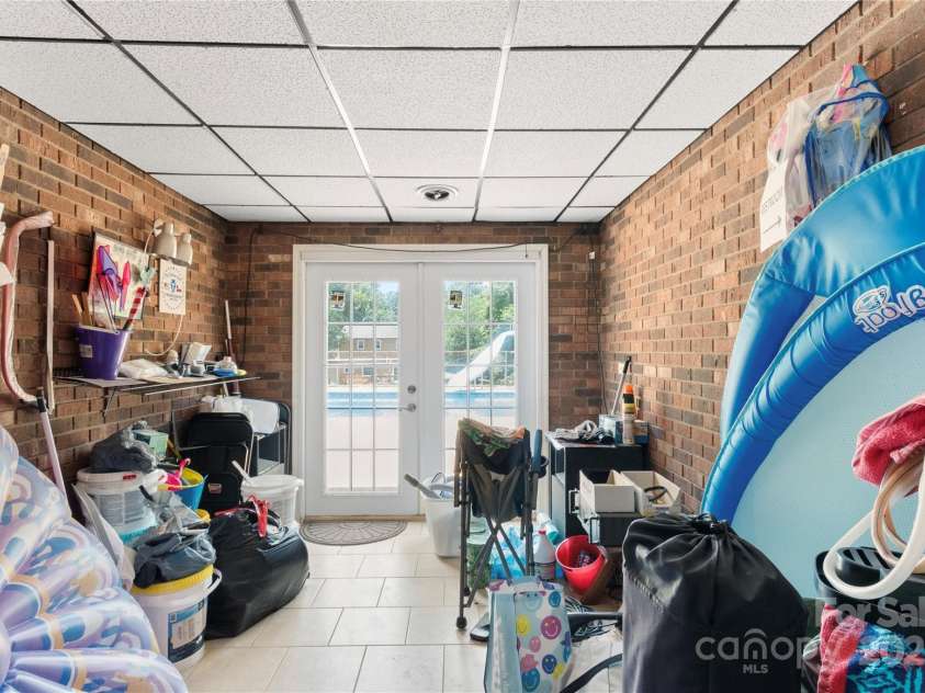 5563 Grace Chapel Road, Hickory, NC 28601.  MLS# CAR4270637, YatesRealty ID 21883. Area going out to pool. Pool supplies will be included at no value.