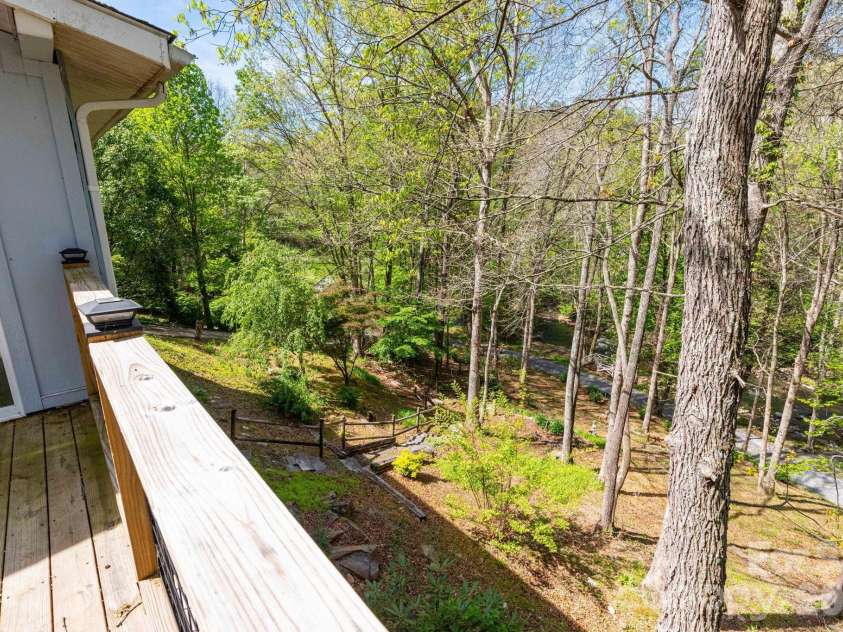 87 Medley Drive, Waynesville, NC 28785.  MLS# CAR4375332, YatesRealty ID 21884. Deck overlooking yard and Jonathan Creek