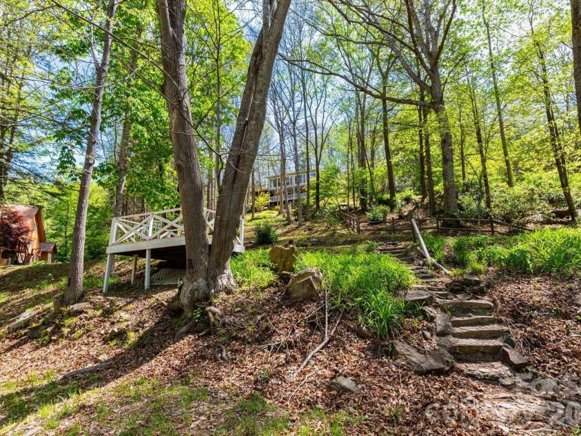 87 Medley Drive, Waynesville, NC 28785.  MLS# CAR4375332, YatesRealty ID 21884. Front Yard with Lower Level Deck