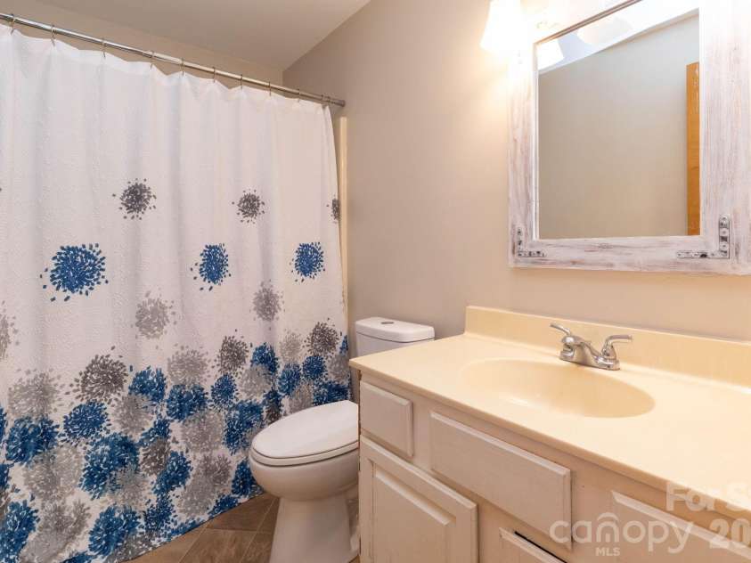 87 Medley Drive, Waynesville, NC 28785.  MLS# CAR4375332, YatesRealty ID 21884. Lower Level Bathroom