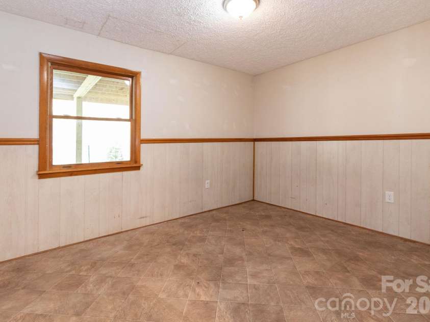 87 Medley Drive, Waynesville, NC 28785.  MLS# CAR4375332, YatesRealty ID 21884. Lower Level Bedroom 1
