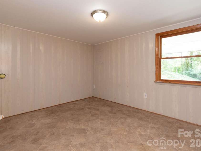 87 Medley Drive, Waynesville, NC 28785.  MLS# CAR4375332, YatesRealty ID 21884. Lower Level Bedroom 2