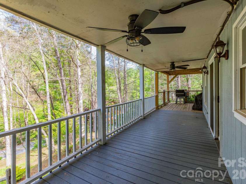 87 Medley Drive, Waynesville, NC 28785.  MLS# CAR4375332, YatesRealty ID 21884. Lower Level Deck