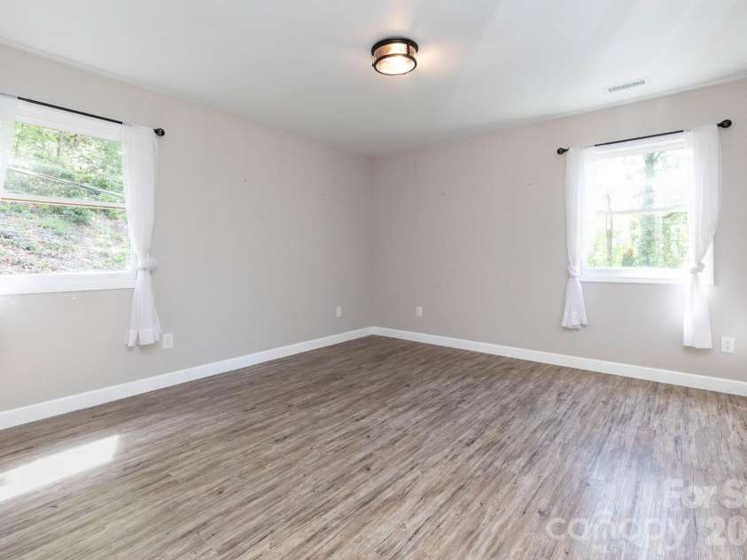 87 Medley Drive, Waynesville, NC 28785.  MLS# CAR4375332, YatesRealty ID 21884. Main Level Bedroom 2